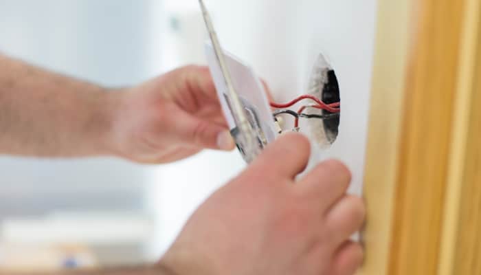 Hands Installing New Electrical Hands Installing New Electrical